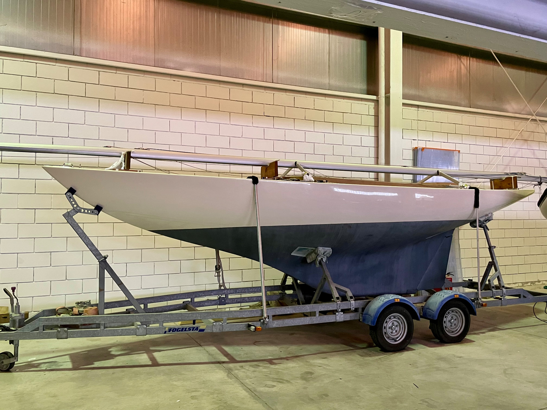 Sailing yacht hull on a Fogelsta trailer inside the Tidal Marine storage facility