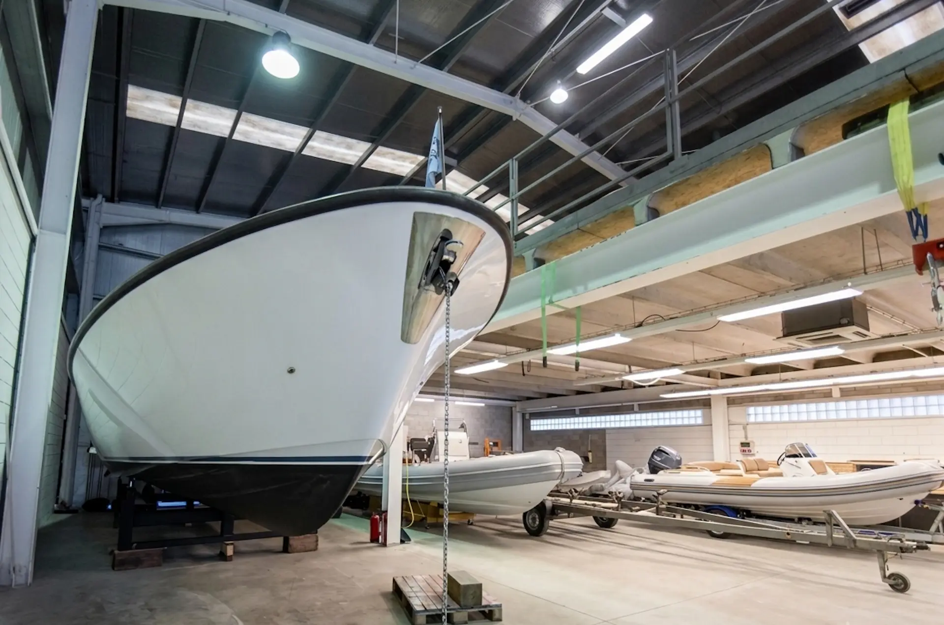 Boat hull on a stand inside the Tidal Marine storage warehouse