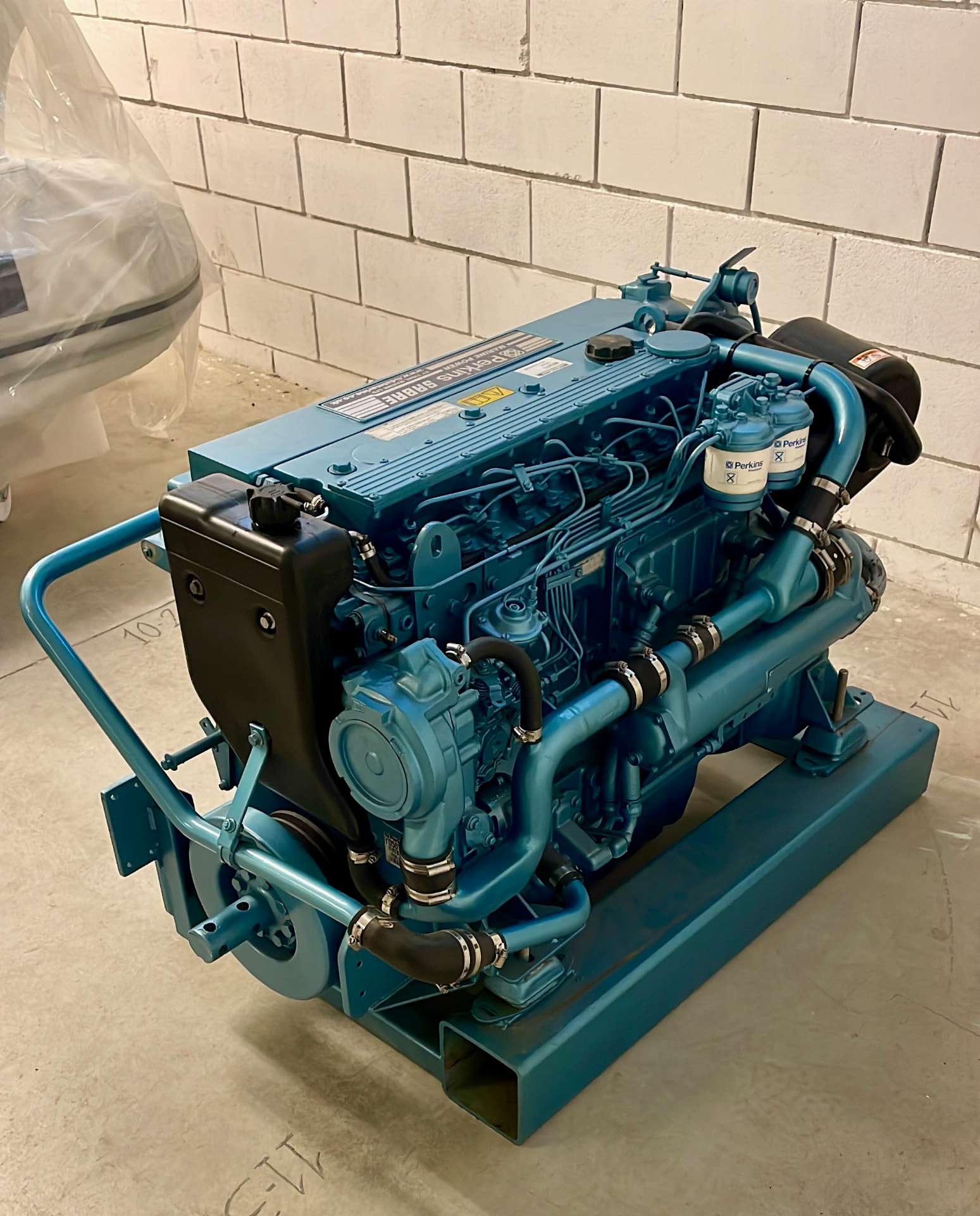 Rebuilt Perkins Sabre marine engine on a stand in the Tidal Marine workshop