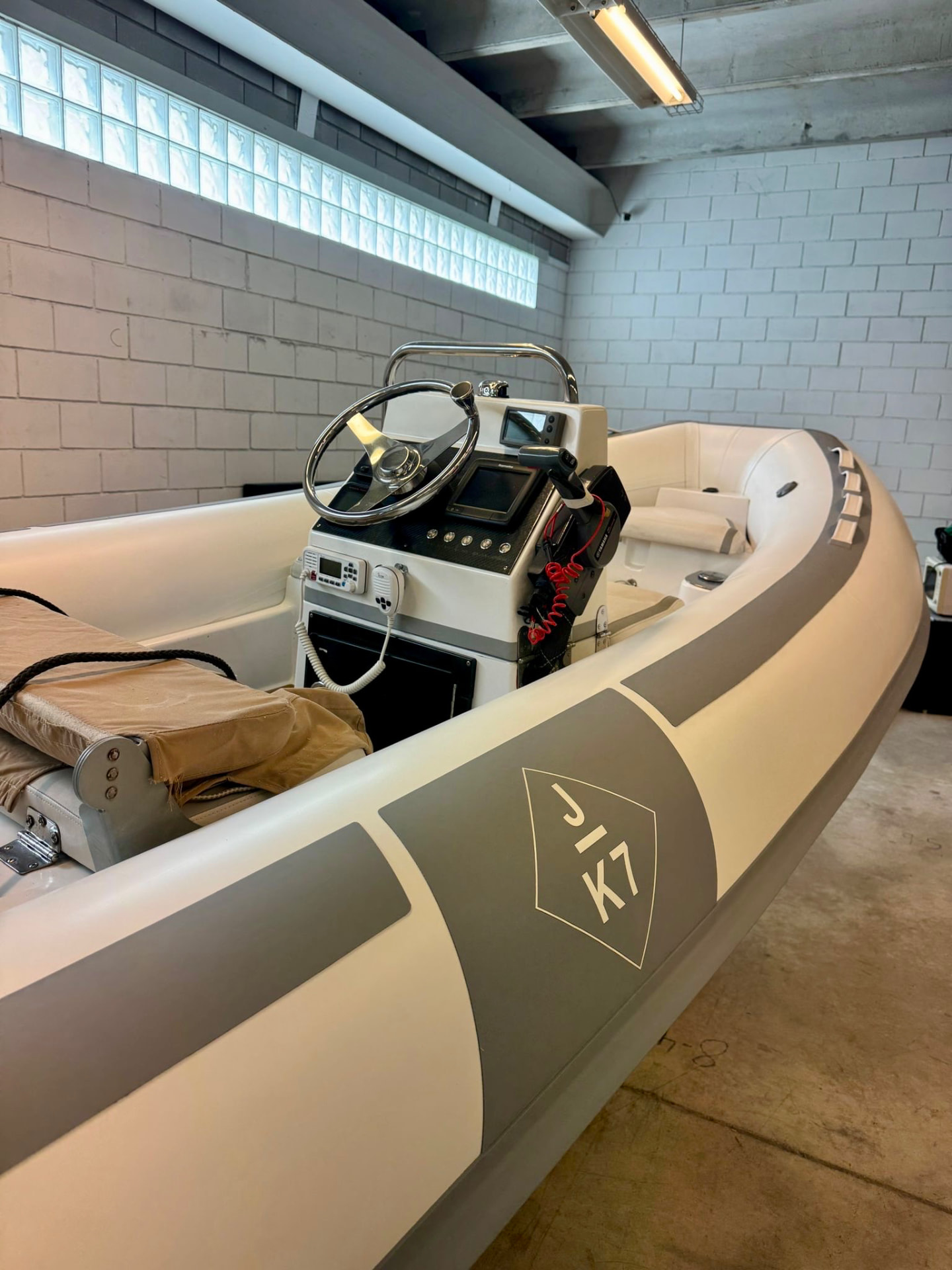 RIB tender helm and console inside the Tidal Marine storage facility